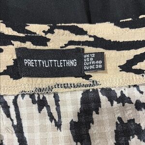 PrettyLittleThing Black and Tan Patterned romper